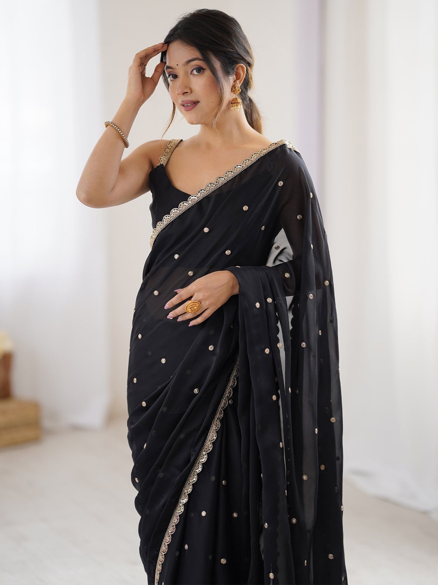 Black Party Wear Pure Georgette Embellished Saree