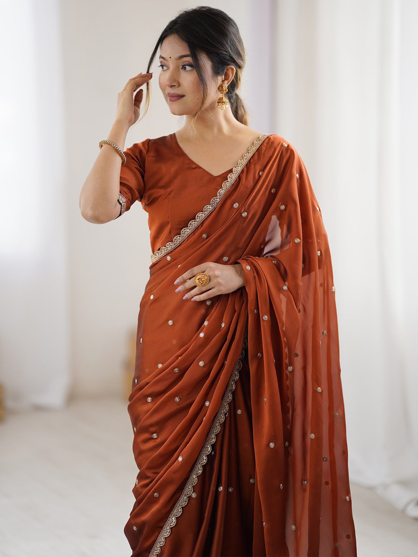 Brown Party Wear Pure Georgette Embellished Saree