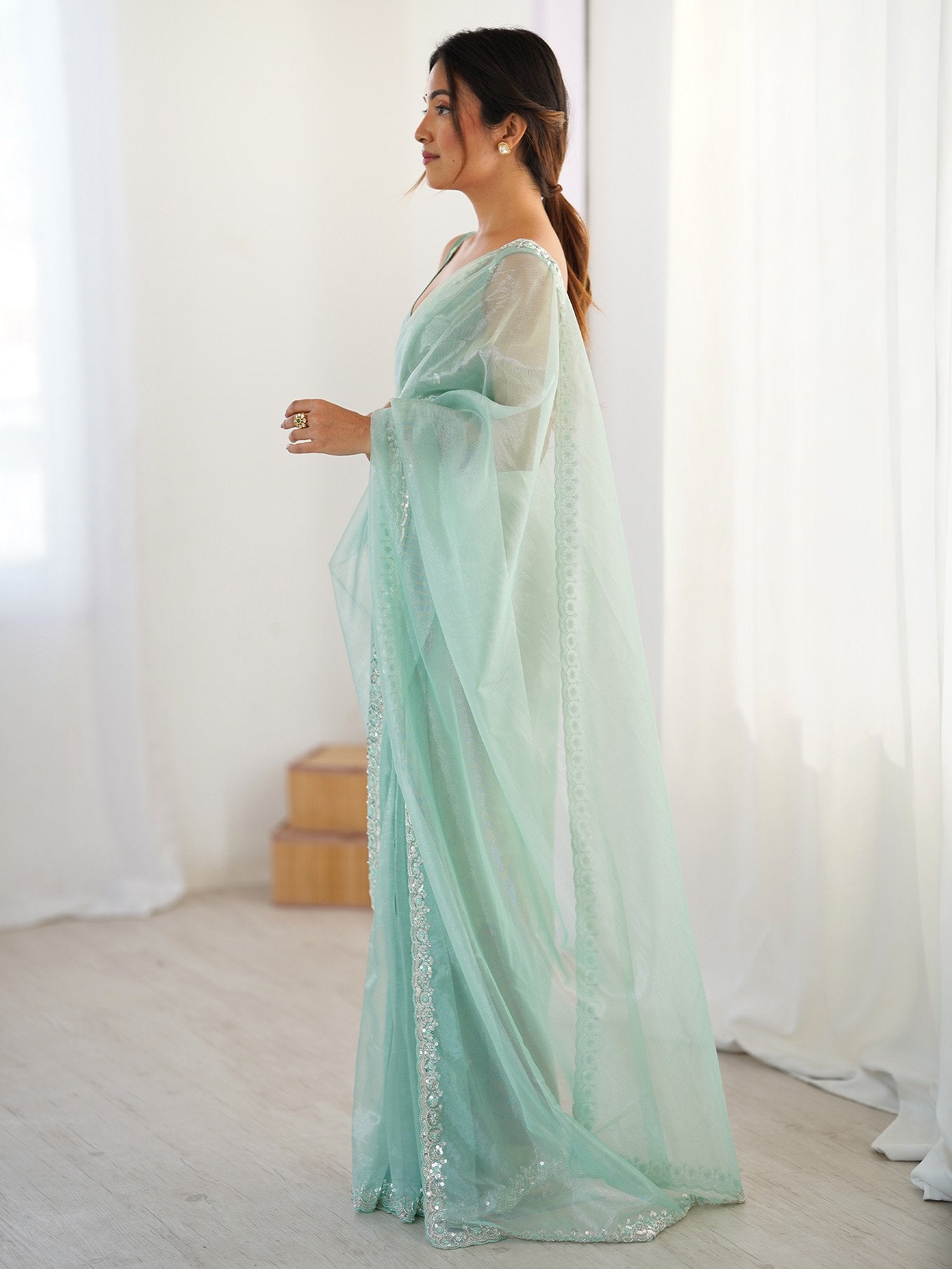 Turquoise Party Wear Net Embellished Saree