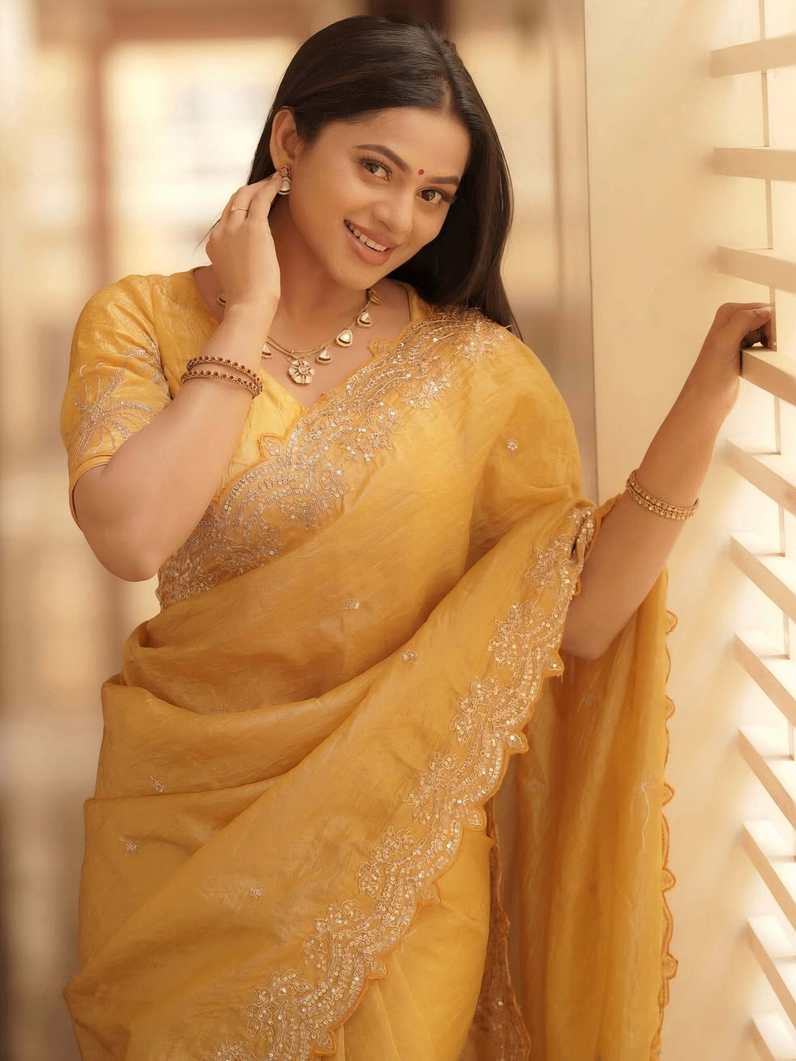 Yellow Party Wear Tissue Embellished Saree