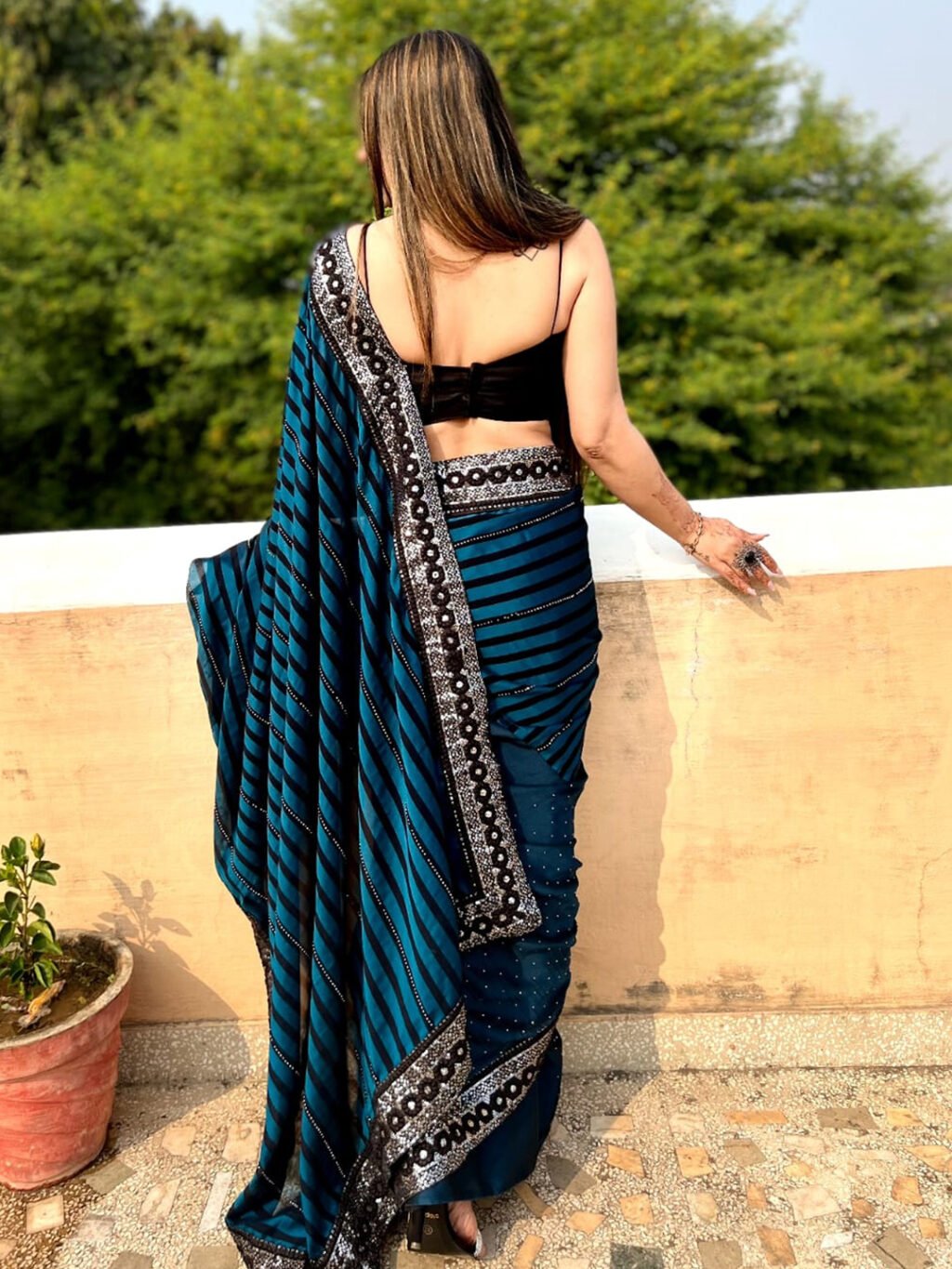 showcasing the beauty and craftsmanship of Party Wear Saree.